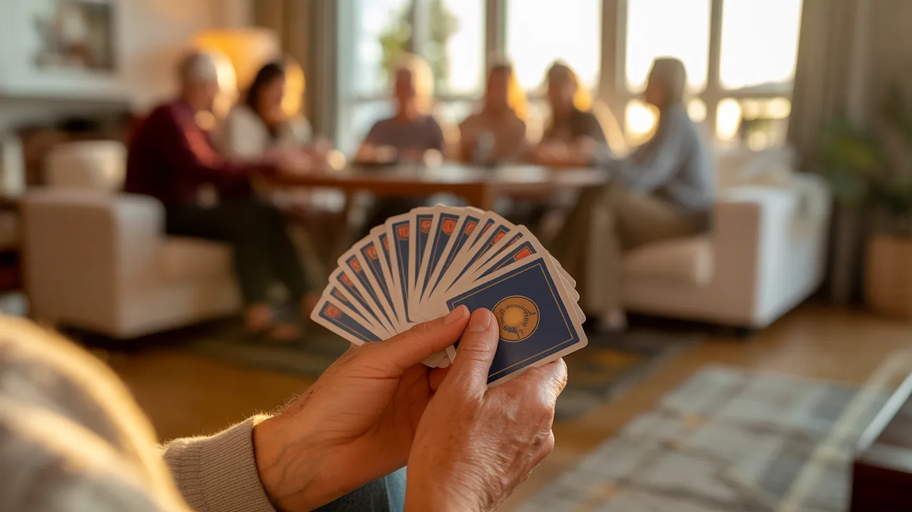 Close-up of a senior's hands holding playing cards during a game with friends in a living room bathed in golden sunlight.